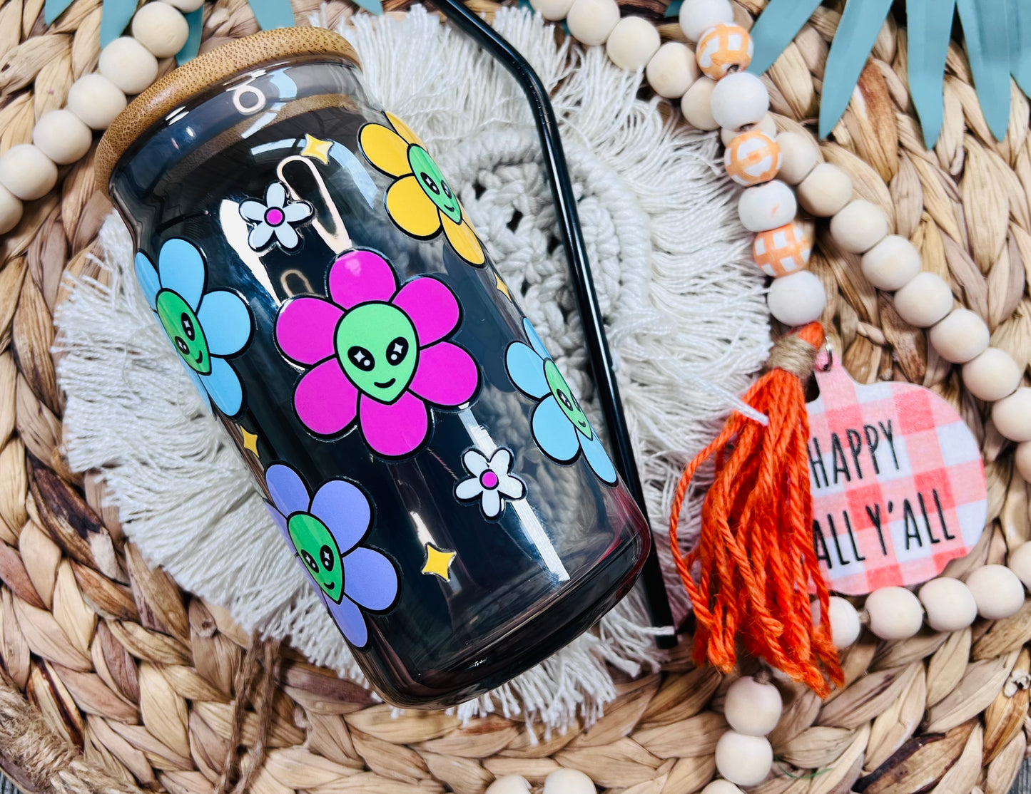 Lata de vidrio con flores alienígenas