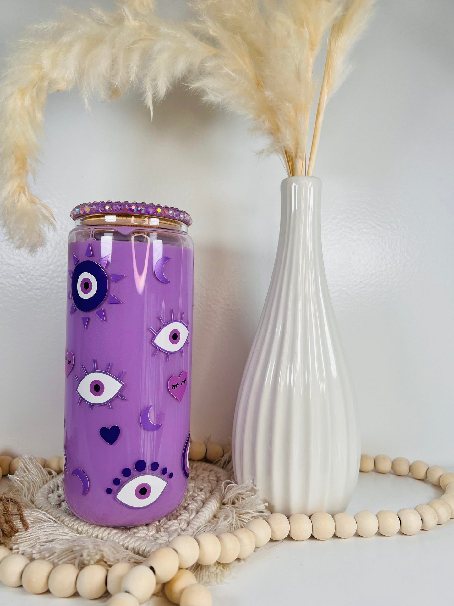 Lata de cristal con forma de bola de nieve con forma de ojo malvado morado