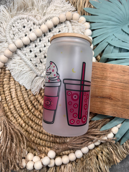 Lata de cristal rosa con forma de ojo malvado